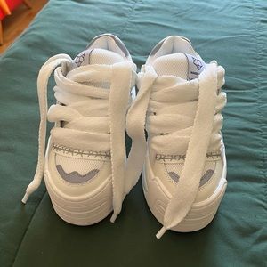 I’m selling a pair of Naked Wolf shoes